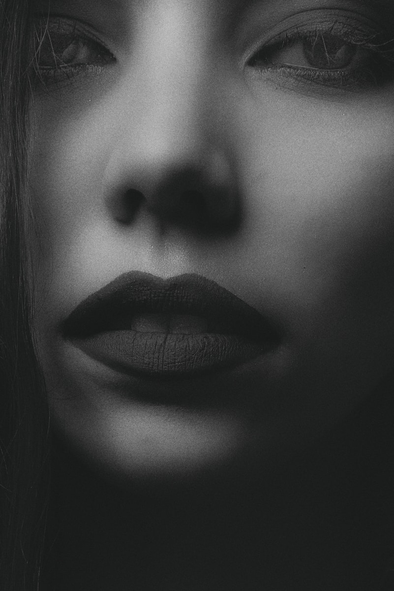 grayscale photo of womans face